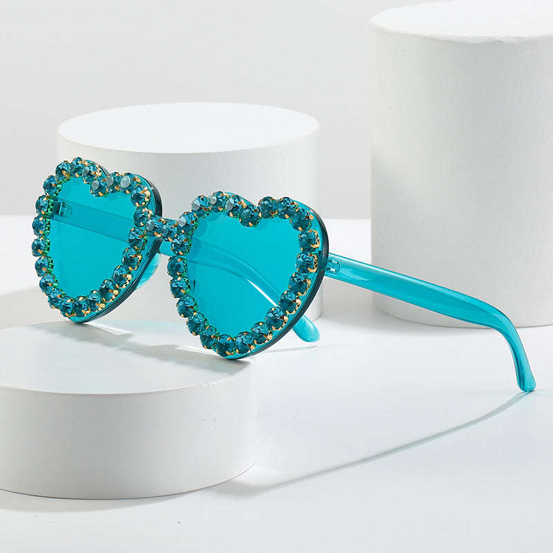 Peach heart-shaped rhinestone sunglasses with Y2K style from FitiqueFit, trendy eyewear with sparkling rhinestone accents.