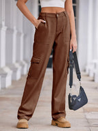 High-waisted plush fashion denim cargo jeans with multiple pockets and a relaxed fit, styled on a model.