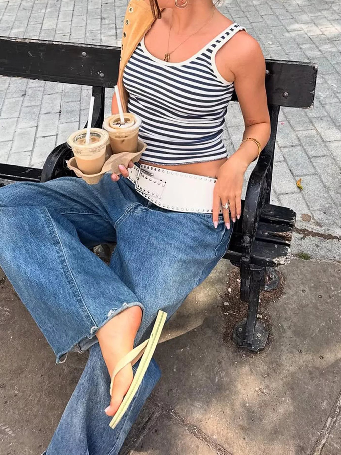 Striped scoop neck tank top by Trendsi featuring horizontal black and white stripes, sleeveless design, and relaxed fit.