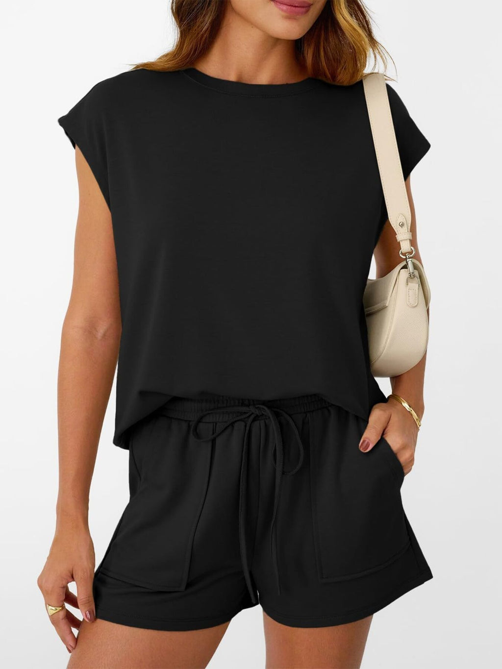Women's soft round neck cap sleeve lounge set with drawstring shorts, casual 2-piece outfit by Trendsi, shown on a model.
