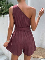 Elegant one-shoulder tie-waist romper jumpsuit in premium polyester, perfect for summer, featuring a stylish and comfortable design.