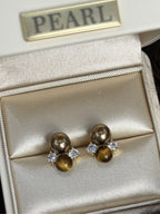 Tiger Eye stud earrings featuring polished, round gemstone jewelry with silver-tone settings, perfect for everyday wear.