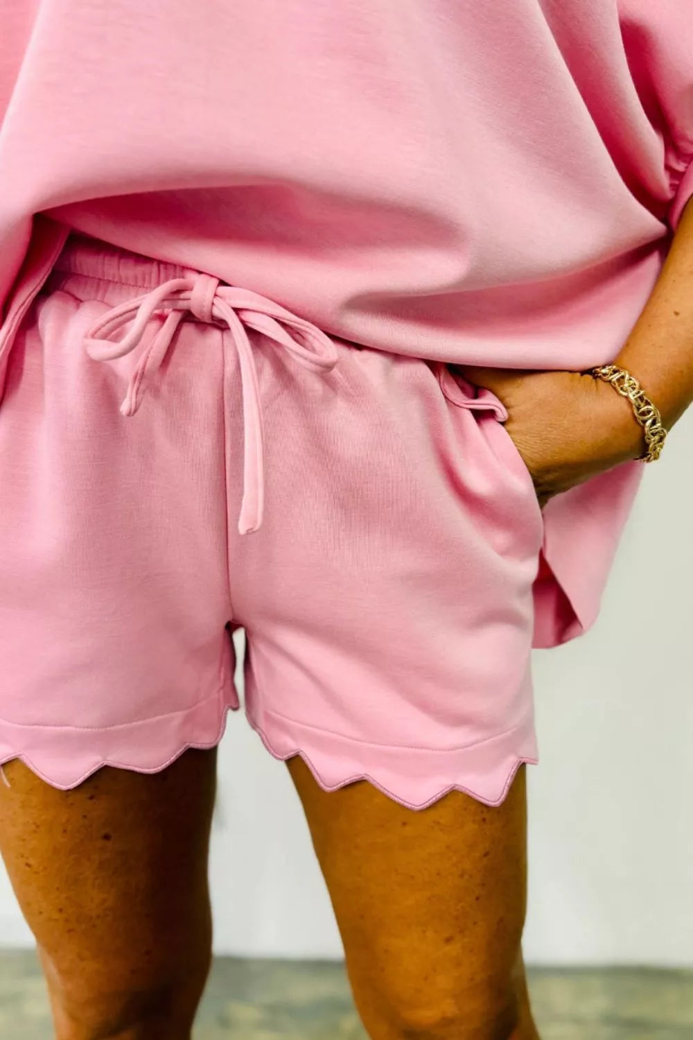 Soft cream scalloped V-neck dolman top and drawstring shorts set, oversized casual clothing from Trendsi.