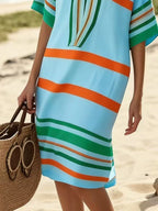 Plus size women's striped half-sleeve midi dress by Trendsi, casual chic design, perfect for everyday wear, shown in the image.