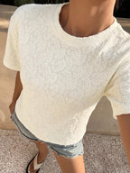 Textured paisley pattern casual T-shirt from Trendsi, showing a close-up of the stylish print and fabric texture.