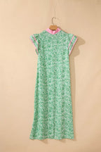 Contrast trim flutter sleeve floral midi dress by Trendsi featuring a flowy silhouette and vibrant floral pattern.