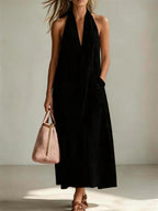 Casual FitiqueFit cotton halterneck sleeveless dress with deep V-neck and loose straight-line fit, perfect for warm weather.