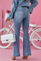 Trendsi bootcut jeans with front and back pockets, classic denim style, fitted through hips and thighs with a flared leg.
