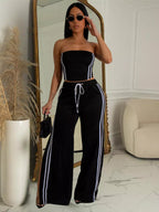 Trendsi sleeveless tube top and wide-leg pants set in neutral fabric, displayed on a hanger with a plain background.