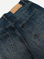Men's washed wide-leg jeans by Trendsi, showing relaxed fit with faded denim and stylish casual design.