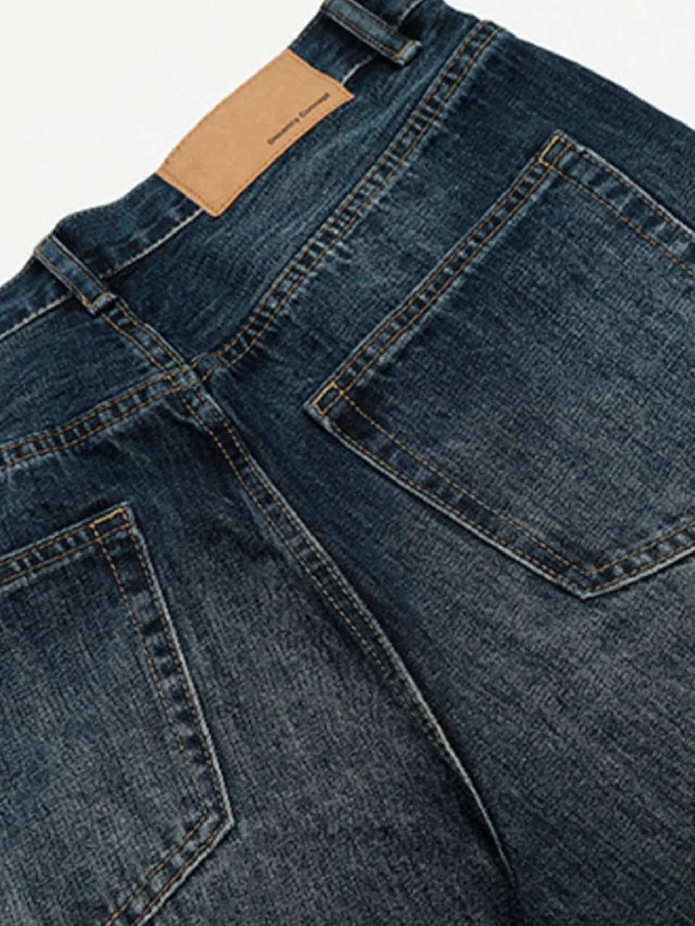 Men's washed wide-leg jeans by Trendsi, showing relaxed fit with faded denim and stylish casual design.