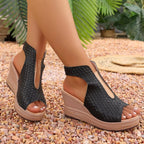 Open toe wedge sandals by Plush Fashion Hub featuring beige straps and a wooden platform heel.