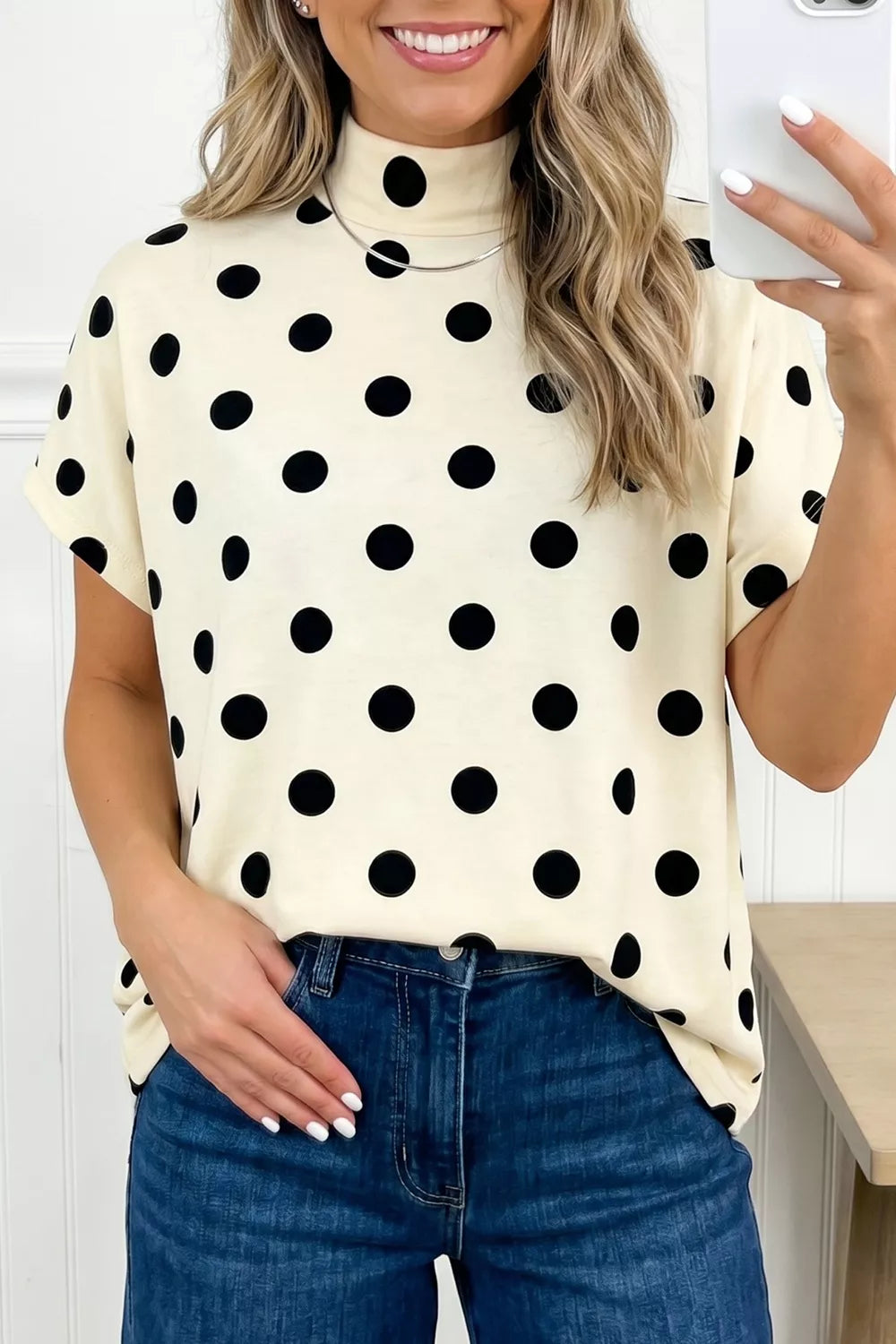 Polka dot print high neck dolman top by Trendsi, featuring a relaxed fit and long sleeves, designed for a stylish casual look.
