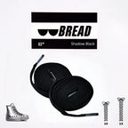Sparkly black elastic shoelaces by Bread, featuring a shiny, stretchy design ideal for comfortable, secure fit on sneakers.