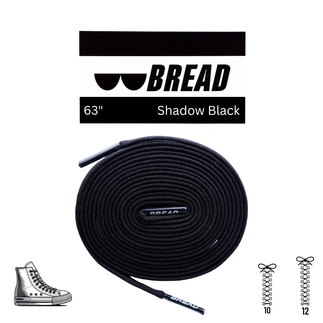 Black elastic shoelace by Bread, showing a close-up of the Shadow Black elastic shoelace with a textured surface and rounded tips.