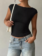 Lace detail cap-sleeve T-shirt by Trendsi featuring a soft fabric, delicate lace accents, and a classic fit in a versatile style.