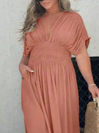 Plus size Trendsi maxi dress with slit V-neck and smocked waist, full-length flowy dress for elegant summer or evening wear.