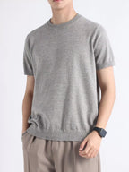 Men's plus size casual knitted short sleeve T-shirt from Trendsi, shown in a relaxed fit with a soft knit fabric.