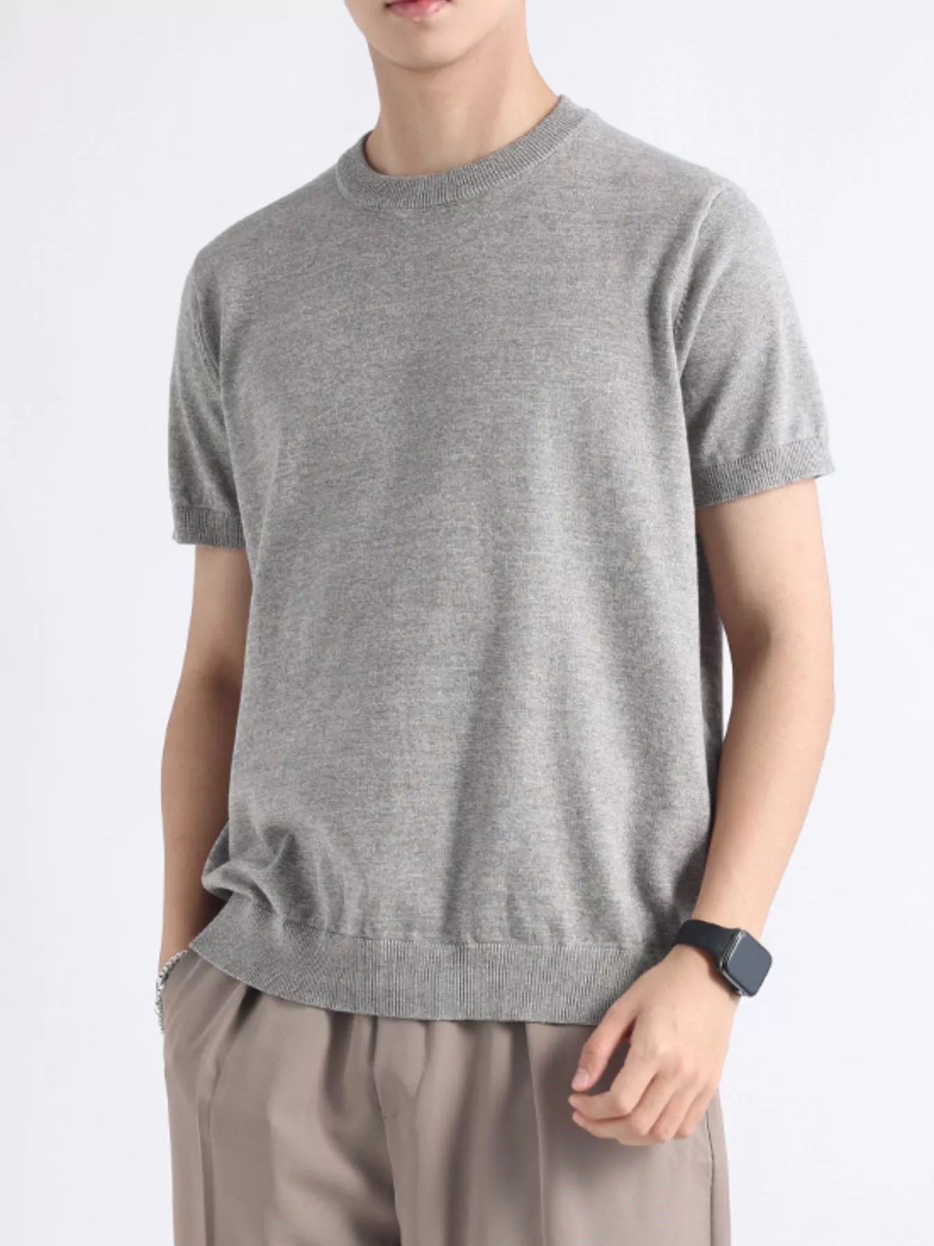 Men's plus size casual knitted short sleeve T-shirt from Trendsi, shown in a relaxed fit with a soft knit fabric.