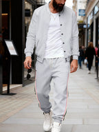 Plus size men's striped snap-down top and pants set from Trendsi, featuring bold horizontal stripes and a comfortable fit.