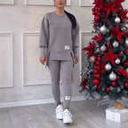 Women's solid color 2-piece casualwear set by FitiqueFit, featuring a comfortable top and matching pants in vibrant fabric.