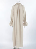 Cotton linen maxi dress with tie neck and flounce sleeves from Trendsi, featuring a flowing silhouette and casual elegance.