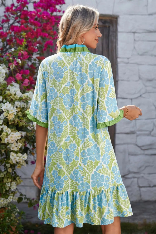 Floral print ruffle hem button-up mini dress by Trendsi, featuring a stylish floral pattern and feminine ruffle details.