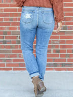 Distressed skinny jeans by Trendsi featuring a fitted style with ripped details and a casual, trendy look.