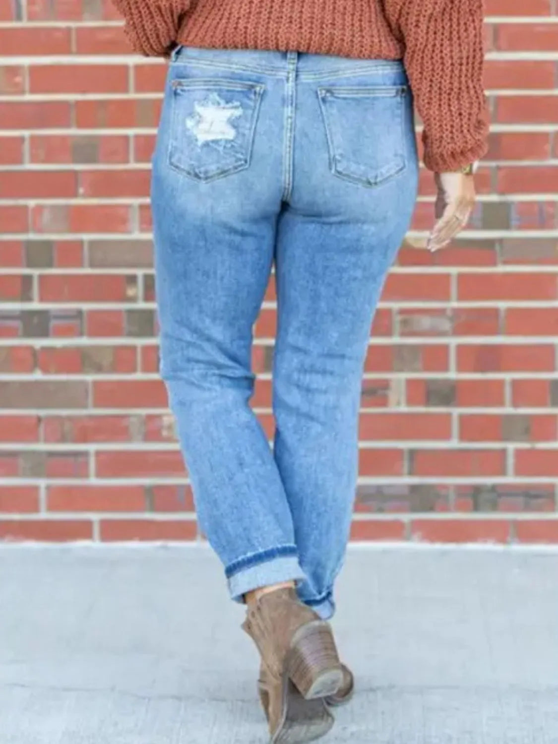 Distressed skinny jeans by Trendsi featuring a fitted style with ripped details and a casual, trendy look.