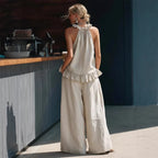 Halterneck loose two-piece casualwear set with pleated fabric and asymmetric pocket details by FitiqueFit.