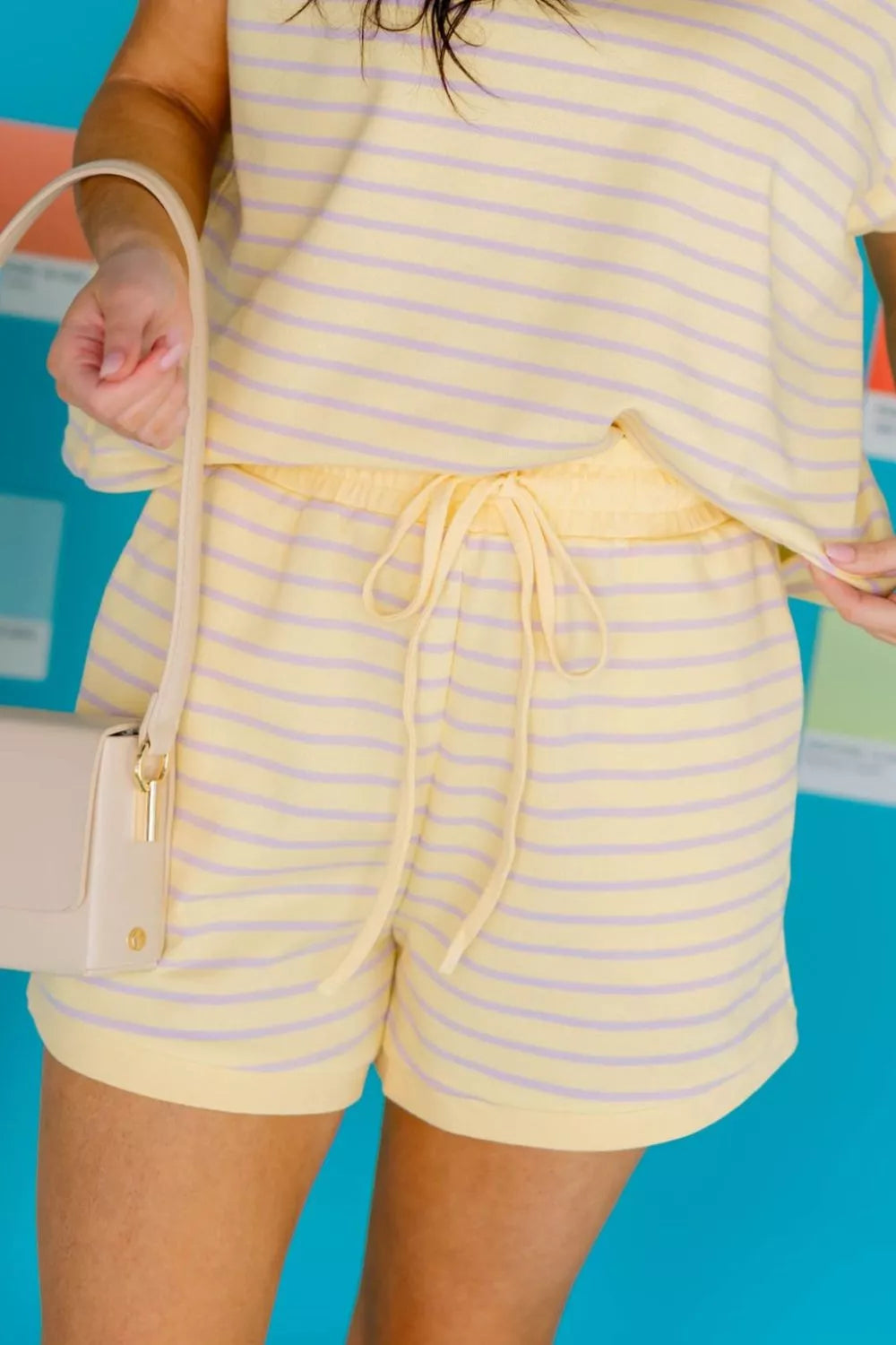Stripe Relaxed Tee and Drawstring Shorts 2-piece outfit, casual men's loungewear set from Trendsi, featuring comfortable fabric and relaxed fit.