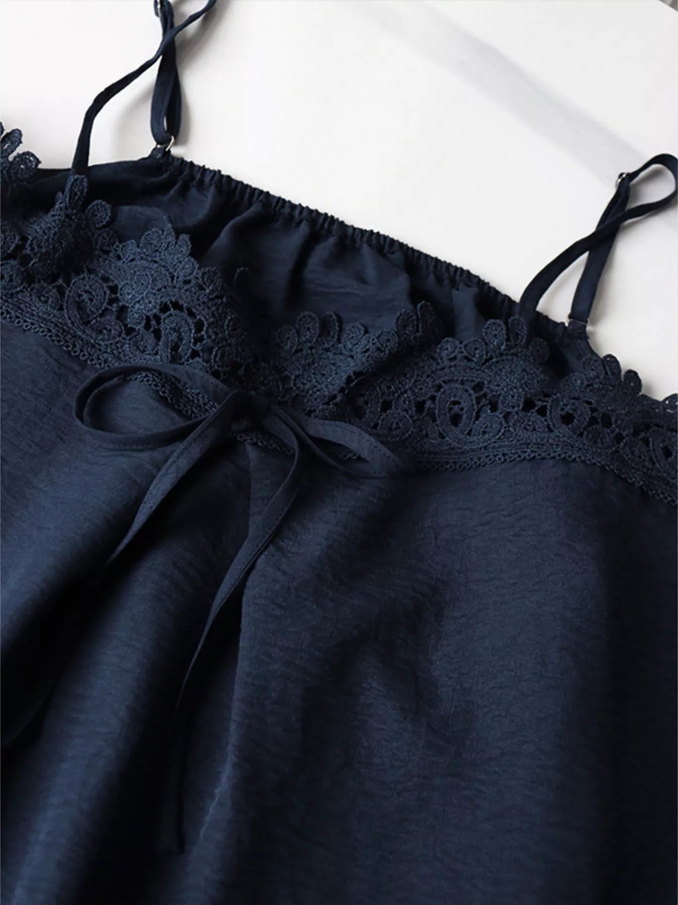 Lace trim cami and wide-leg pants set from Trendsi, featuring a delicate lace-trimmed top and flowy matching pants.