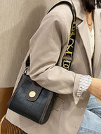 Crocodile embossed wide strap crossbody bag in premium PU leather with sleek design and textured crocodile pattern.