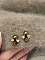 Tiger Eye stud earrings featuring polished, golden-brown gemstones set in silver posts, stylish and elegant jewelry accessory