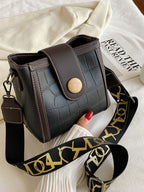 Crocodile embossed wide strap crossbody bag in premium PU leather with sleek design and durable hardware.
