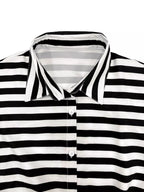 Striped button-up belted romper from Trendsi featuring short sleeves, a collar, and a waist belt for a stylish summer look.