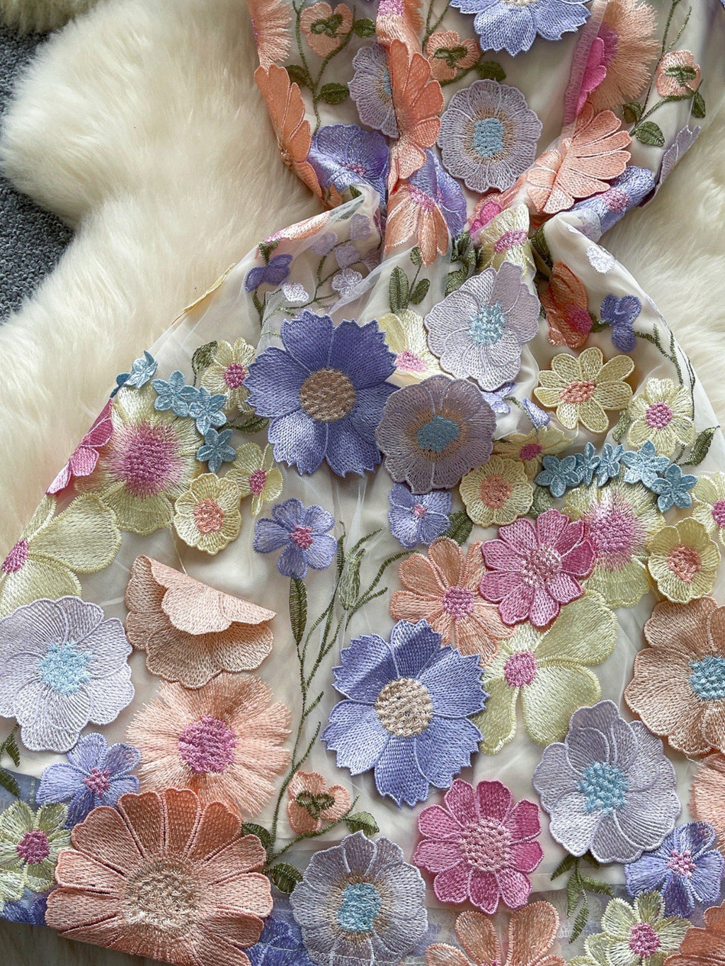 Floral embroidered tie waist mini dress by Trendsi featuring an elegant summer A-line silhouette with vibrant floral embroidery.