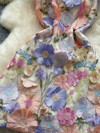 Floral embroidered tie waist mini dress by Trendsi featuring an elegant summer A-line silhouette with vibrant floral embroidery.