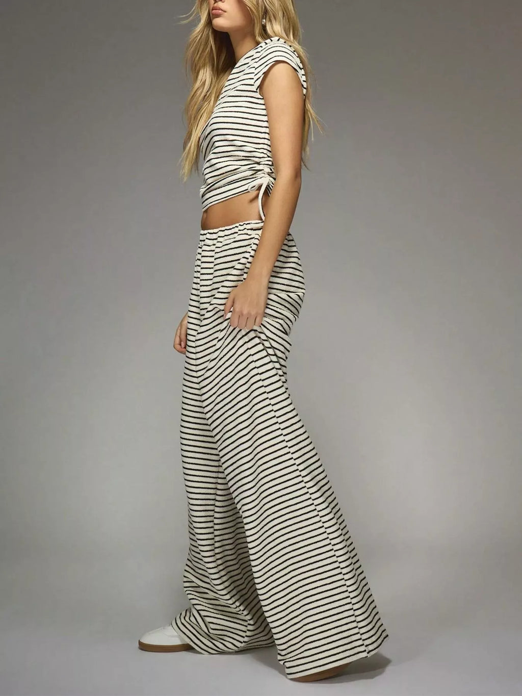 Striped crop top and wide-leg pants set by Trendsi, featuring a stylish coordinated dress with bold stripes and comfortable fit.