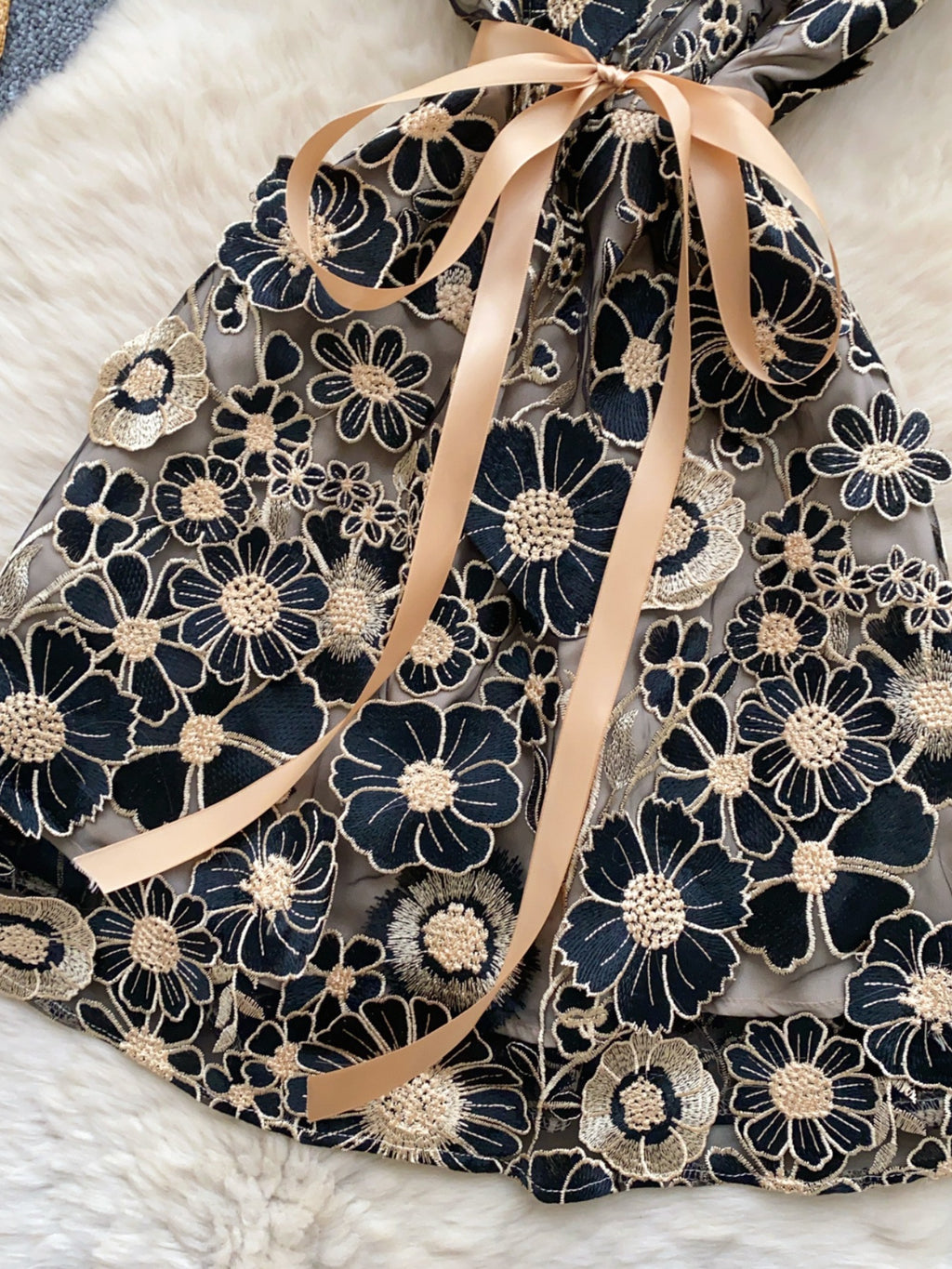 Floral embroidered tie waist mini dress by Trendsi featuring an elegant summer A-line silhouette with colorful floral embroidery.