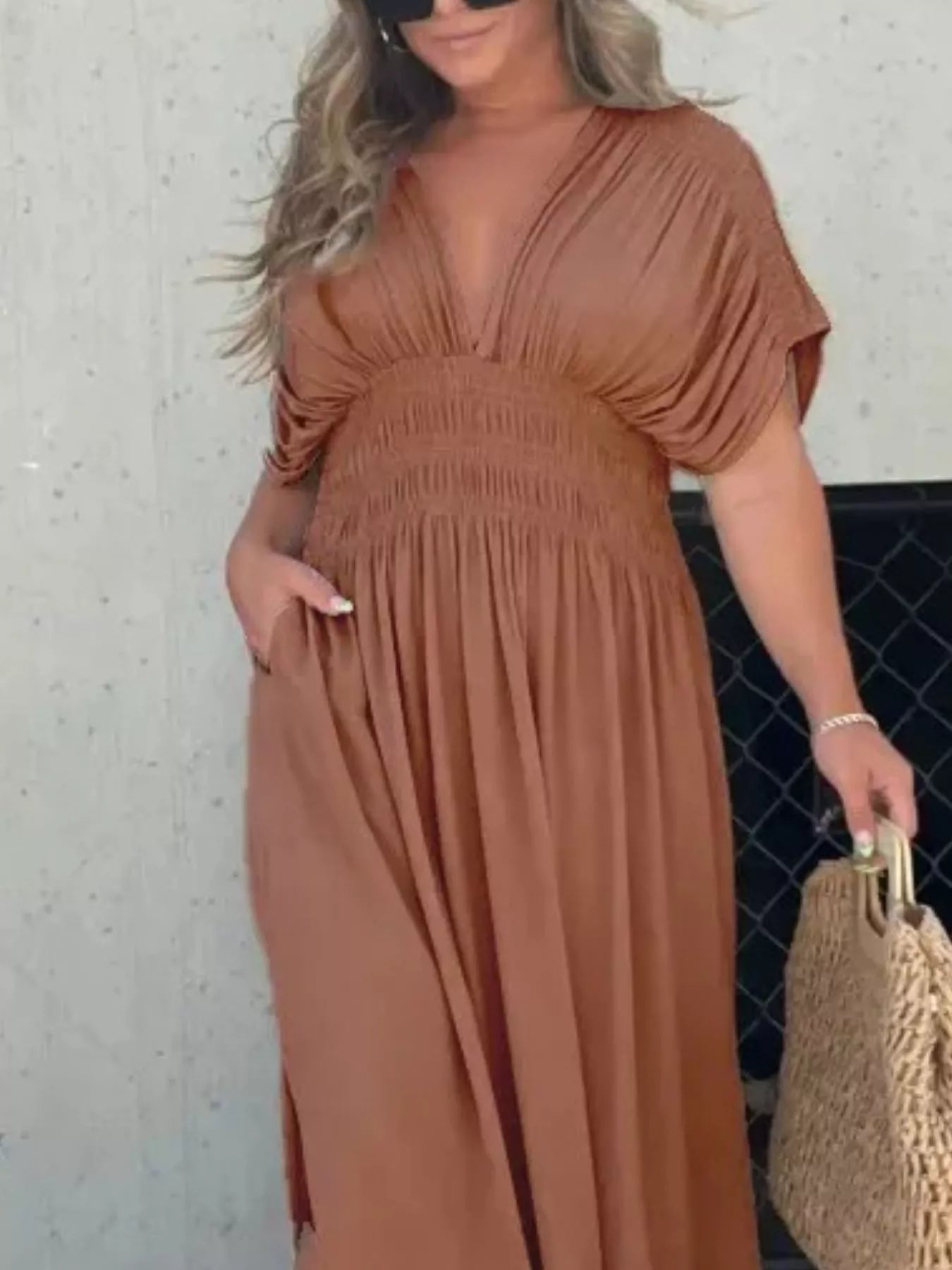 Plus size maxi dress with slit V-neck and smocked waist by Trendsi, featuring flowing fabric and a stylish, elegant design.