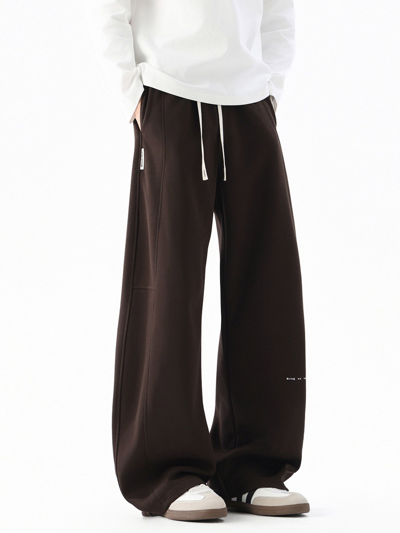 Men's wide leg casual drawstring pants with relaxed fit, shown in neutral color, featuring comfortable waistband and relaxed style.