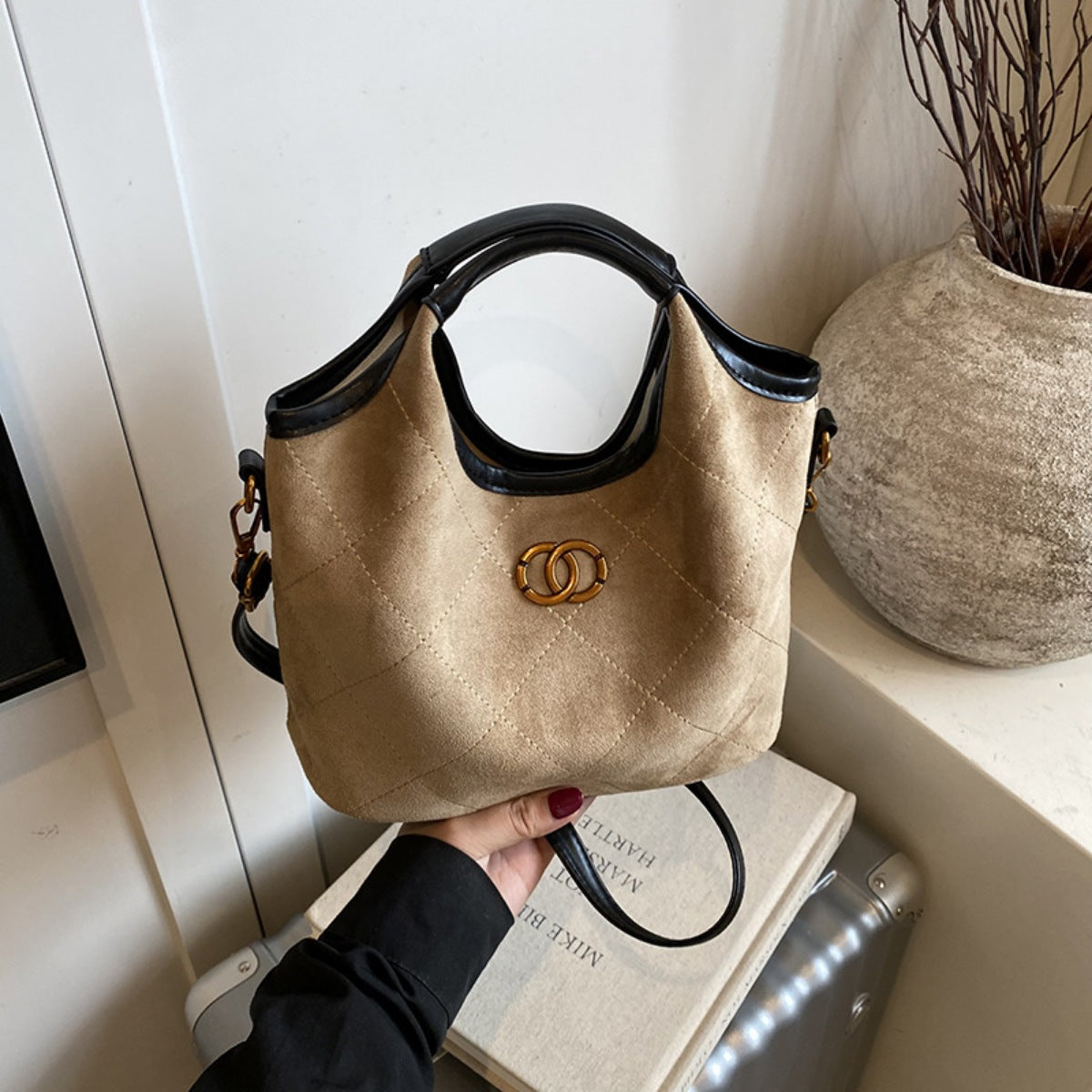 Luxurious suede medium top handle handbag by Trendsi, featuring an elegant design with a shoulder strap and stylish details.