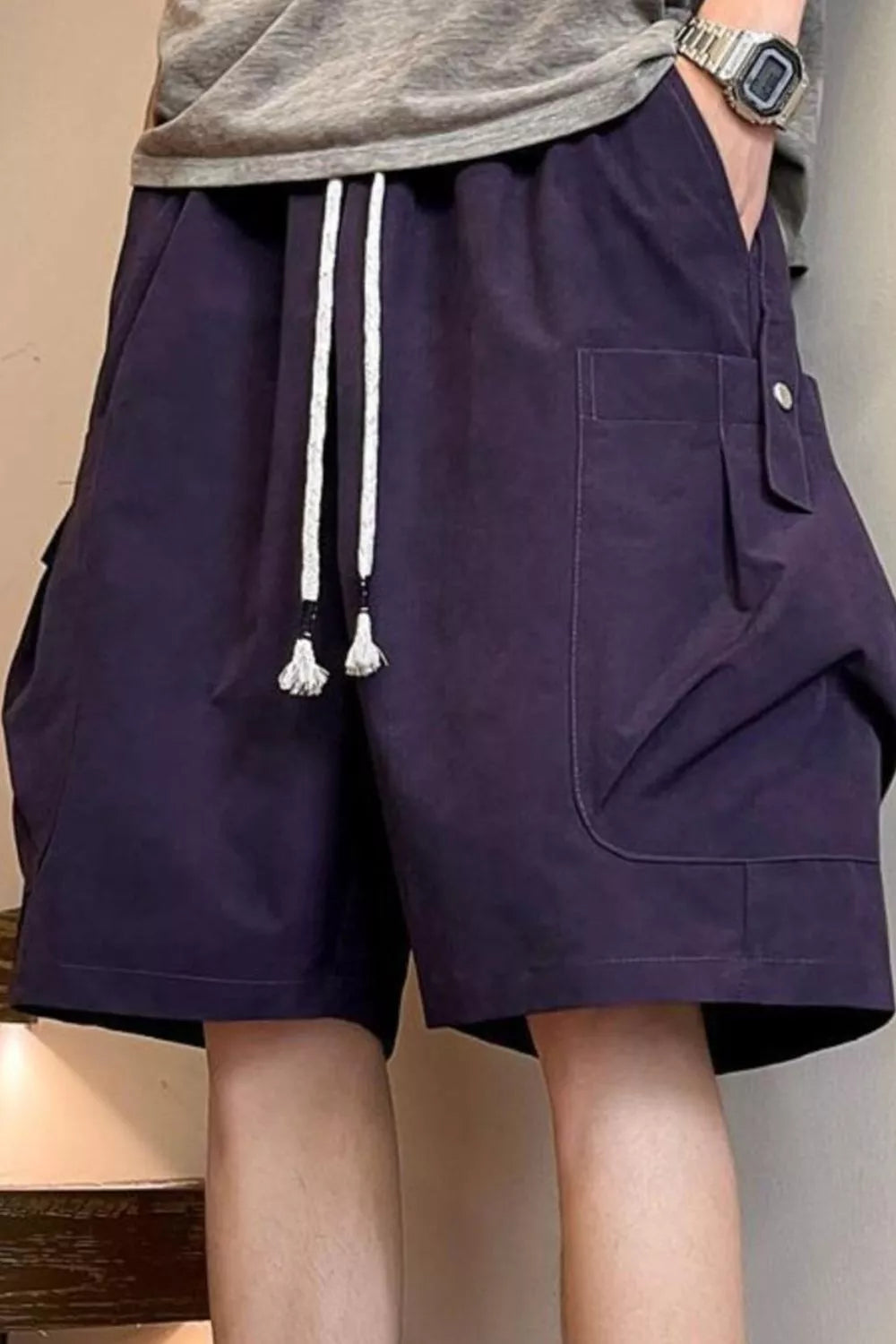 Men's full size drawstring shorts with pockets by Trendsi, featuring a comfortable fit and casual design in plus sizes.