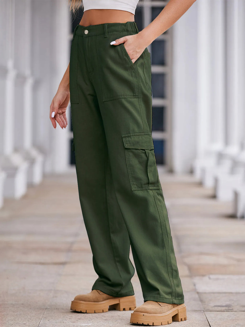 High-waisted cargo denim jeans by Plush Fashion Shop, featuring multiple pockets and a relaxed fit, displayed on a hanger.