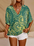 Women's printed V-neck casual top with half sleeves, soft stretch fabric, stylish office blouse by Trendsi.