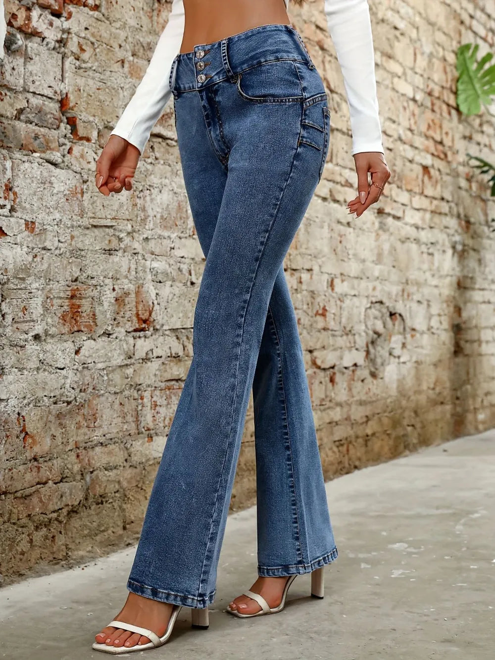 Plush Fashion Shop denim bootcut jeans with five pockets, classic blue wash, and relaxed fit for casual style.