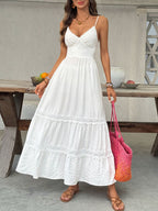 Women's V-neck tiered maxi dress with delicate lace detail by Trendsi, featuring flowing fabric and elegant design.