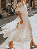 Bohemian lace maxi dress with short sleeves, flowing plus size gown, featuring intricate lace details and a relaxed, elegant fit.
