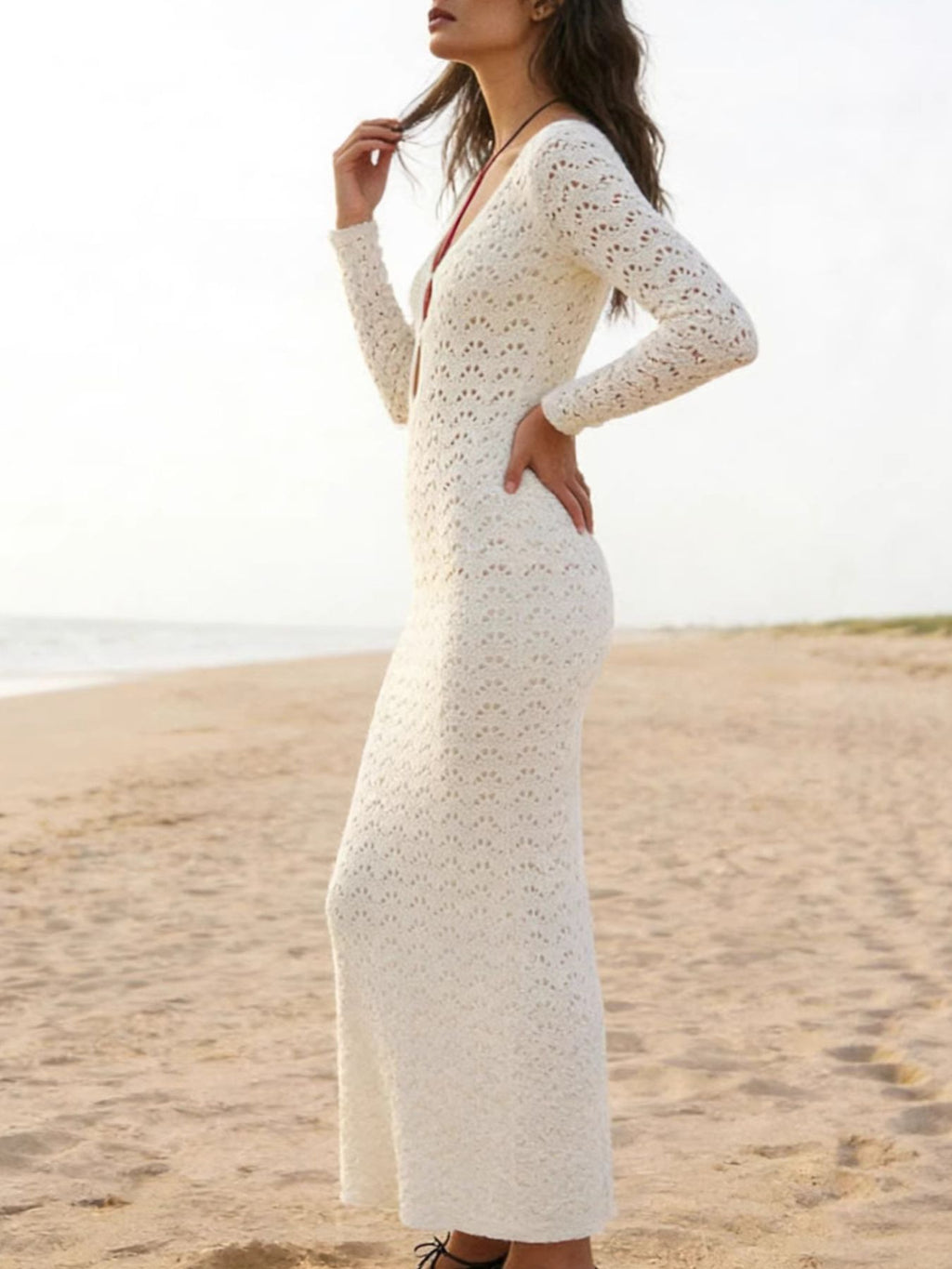 Sheer crochet mesh boho beach cover-up dress from Trendsi, featuring a loose fit and intricate knit design for swimwear cover.